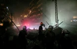 Des secouristes fouillent les décombres dans la banlieue sud de Beyrouth, le 6 juin 2025 quelques heures après des frappes israéliennes