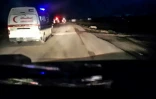 Une image tirée d'une vidéo récupérée sur le téléphone portable d'un secouriste tué à Rafah dans le sud de Gaza selon le Croissant-Rouge palestinien le 5 avril 2025, montre une ambulance du Croissant-Rouge palestien aux feux et gyrophares allumés derrière d'autres véhicules à Rafah
