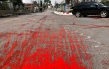 Photo diffusée le 6 avril 2021 par Kanbawza Tai News montrant de la peinture rouge déversée sur une route à Taunggyi, dans l'Etat Karen, en mémoire aux manifestants tués par l'armée et la police birmanes