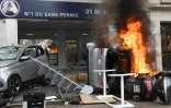 Une voiture et un scooter brûlés lors des débordements en marge de la manifestation du 1er mai 2018 à Paris