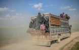 Un camion transporte des personnes ayant fui le village de Baghouz, dernier réduit du groupe jihadiste Etat islamique dans l'est de la Syrie, le 22 février 2019 
