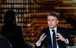 Le président français Emmanuel Macron répond aux questions des journalistes lors d'une interview télévisée au Grand Palais, à Paris, le 9 février 2025