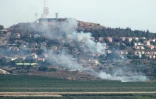 Photo prise au Sud-Liban de la fumée s'élevant de la ville israélienne de Metulla, après des tirs de roquettes transfrontaliers depuis le Liban, le 26 juin 2024