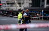 Des policiers sur les lieux d'une fusillade dans le centre d'Auckland, le 20 juillet 2023 en Nouvelle-Zélande