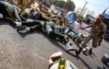 Des soldats à terre lors d'un attentat commis le 22 septembre 2018 lors d'un défilé militaire dans la ville iranienne d'Ahvaz