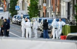 Des membres de la police scientifique dans une rue de la commune bruxelloise de Schaerbeek, après une attaque qui a coûté la vie à deux Suédois, le 17 octobre 2023