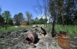 Un village abandonné dans la zone d'exclusion de Tchernobyl, dévasté par un incendie de forêt, le 11 juin 2020 en Ukraine