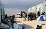 Des déplacés syriens emménagent dans un complexe résidentiel, construit près de la ville d'al-Bab, le 9 février 2022 en Syrie 