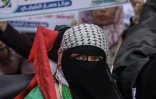 Des Palestiniens manifestent contre la "marche des drapeaux" organisée à Jérusalem, à Khan Younès dans le sud de la bande de Gaza, le 18 mai 2023
