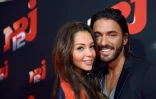 La starlette franco-suisse de la téléréalité Nabilla Benattia (g) et son compagnon Thomas Vergara au siège du groupe NRJ à Paris le 21 octobre 2013