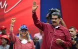 Le président vénézuélien Nicolas Maduro (d) et sa femme Cilia Flores lors d'un rassemblement à Caracas, le 1er mai 2023