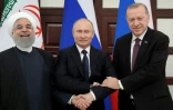 Le président russe Vladimir Poutine (c) et ses homologues turc Recep Tayyip Erdogan (d) et iranien Hassan Rohani, le 14 février 2019 à Sotchi