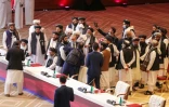 Des représentants des talibans à l'issue d'une séance de pourparlers avec des représentants du gouvernement afghan, le 12 septembre 2020 à Doha, au Qatar