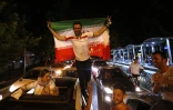 Les Iraniens célèbrent la victoire de leur équipe face au Maroc lors du Mondial, le 15 juin 2018 à Téhéran