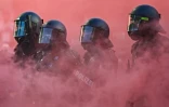 Policiers anti-émeute lors d'une manifestation "No G7" à Genève, le 14 juin 2026