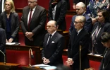 Bernard Cazeneuve lors de la minute de silence observée en hommage aux victimes de l'attentat de Berlin, le 20 décembre 2016 à l'Assemblée nationale à Paris