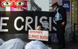 Une action de militants du groupe Extinction Rebellion en marge de la COP26 à Glasgow le 11 novembre 2021 