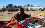 Des civils fuyant les combats attendent dans les zones contrôlées par les Forces démocratiques syriennes près du village de Baghouz, le 3 février 2019