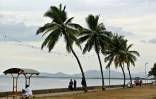 Residents spend their morning on a beach next to the port in Nadi on October 4, 2026, ahead of the Pacific Pre-COP31 Summit's opening ceremony.