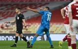 La célébration de l'attaquant marocain de l'Olympiakos, Youssef El-Arabi, après avoir ouvert le score contre Arsenal, lors de leur match retour de Ligue Europa, le 18 mars 2021 au Emirates Stadium à Londres