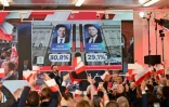Les partisans du candidat nationaliste Karol Nawrocki réagissent aux sondages publiés après le premier tour de la présidentielle en Pologne, le 18 mai 2025 à Varsovie