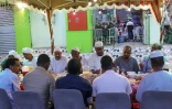 Des Soudanais bloqués, en Arabie saoudite, se retrouvent pour l'iftar collectif, le repas de rupture de jeûne du ramadan, le 27 mars 2024 à Ryad 