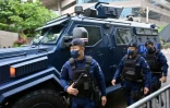 Une unité spéciale de la police séccurise le quartier de Wanchai, pendant la visite du président Xi Jinping pour le 25e anniversaire de la rétrocession de l'ancienne colonie britannique, le 30 juin 2022