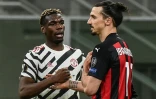 Le milieu de terrain de Manchester United, le Français Paul Pogba, salue l'attaquant de l'AC Milan, le Suédois Zlatan Ibrahimovic, à la fin de leur match retour de Ligue Europa, le 18 mars 2021 au stade San Siro