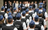 Des policiers participent à la cérémonie funèbre pour rendre hommage aux policières tuées à Liège, en Belgique, le 5 juin 2018
