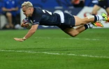 L'ailier écossaise Darcy Graham marque un essai lors du match de la coupe du monde de rugby Pool B entre l'Écosse et les Tonga, le 24 septembre 2023 au Stade de Nice 