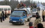 Rebelles et civils sont évacués des quartiers est d'Alep le 16 décembre 2016 vers la région de Khan al-Aassal (ouest d'Alep)