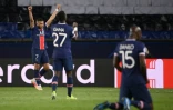 Les joueurs du PSG Kylian Mbappé, Idrissa Gueye et Danilo Pereira célèbrent leur qualification pour les demi-finales de la Ligue des champions, le 13 avril 2021 au Parc des Princes