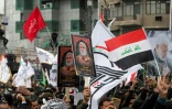 Des partisans du Hachd al-Chaabi, coalition de factions irakiennes pro-Iran, manifestent dans les rues de Bagdad le 1er janvier 2022, pour commémorer le deuxième anniversaire de l'assassinat par les Etats-Unis du général irakien Qassem Soleimani et de son lieutenant irakien