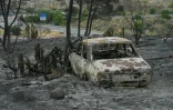 Une voiture calcinée dans une zone touchée par un incendie de forêt meurtrier à Almocaizar, dans la province d'Almería, le 12 juillet 2026 en Espagne
A wildfire that has killed at least 12 people in southern Spain was close to being brought under control Sunday, allowing hundreds of evacuated residents to return home as firefighters worked to fully stabilise the blaze, offficials said. Authorities have kept the death toll at 12 and cautioned that the number of missing people remains uncertain until autopsies and the identification of recovered bodies are completed.