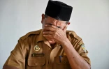 Djafaruddin, saisi par l'émotion, lors d'une interview à Banda Aceh, le 19 novembre 2024 en Indonésie