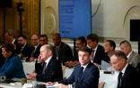 Le président français Emmanuel Macron (2e d) et le chancelier allemand Olaf Scholz à l'ouverture d'une conférence en soutien à l'Ukraine, le 26 février 2024 à l'Elysée, à Paris