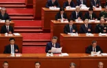 Le président chinois Xi Jinping (c) lors de la séance de clôture de l'Assemblée nationale populaire (ANP) au Palais de l'Assemblée du Peuple à Pékin, le 12 mars 2026