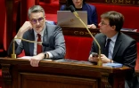 Le député du groupe Renaissance Florent Boudié (G) et le député du même groupe Sacha Houlié (D) à l'Assemblée nationale lors des débats sur le projt de loi immigration le 11 décembre 2023