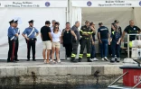 L'attente au port italien de Porticello, en Sicile, le 22 août 2024, où les secouristes ont rapporté les corps de cinq des six personnes portées disparues depuis le naufrage du yacht du magnat britannique Mike Lynch - au nombre des victimes.