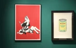 Les ?uvres "Queen Vic" et "Soup can yellow" réalisées par l'artiste britannique Banksy exposées à la vente chez Artcurial à Paris, le 24 octobre 2018