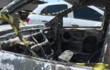 La voiture carbonisée de l'ambassadeur grec au Brésil, Kyriakos Amiridis, parquée près du commissariat de police, le 30 décembre 2016