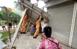 Photo diffusée le 10 octobre 2025 sur la page Facebook du Bureau de protection contre les incendies de la région 11 montrant des dégâts à Baganga, dans la province de Davao, sur l'île méridionale de Minadanao, après un séisme aux Philippines