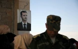 Photo du portrait du président syrien Bachar al-Assad prise pendant une visite de soldats russes à Suran, dans la province d'Hama, en Syrie, le 25 septembre 2019