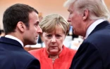 Le président français Emmanuel Macron, la chancelière allemande Angela Merkel et le président américain Donald Trump à Hambourg, en Allemagne, le 7 juillet 2017
