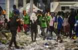 Des migrants retenus dans un "hotspot" sur l'île italienne de Lampedusa, le 14 septembre 14, 2023