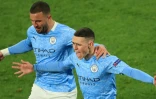 La joie du milieu de terrain de Manchester City, Phil Foden (d), après son but marqué contre Dortmund, lors du quart de finale retour de la Ligue des Champions, le 14 avril 2021 à Dortmund