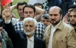 Le candidat ultraconservateur à la présidentielle iranienne, Saïd Jalili (G), le 5 juillet 2024, dans un bureau de vote de Téhéran