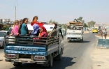 Des Syriens habitant le sud de la province d'Idleb, ultime bastion rebelle dans le pays en guerre, fuient les bombardements du régime de Bachar al-Assad, le 6 septembre 2018