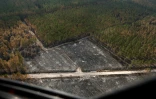Photographie prise depuis un hélicoptère du Service départemental d'incendie et de secours (SDIS 33) montrant les ravages causés par un incendie à Landiras, le 23 juillet 2022 