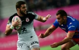 L'arrière de Toulouse Thomas Ramos (g) à l'offensive contre le Stade français, le 5 janvier 2020 au stade Jean-Bouin à Paris 